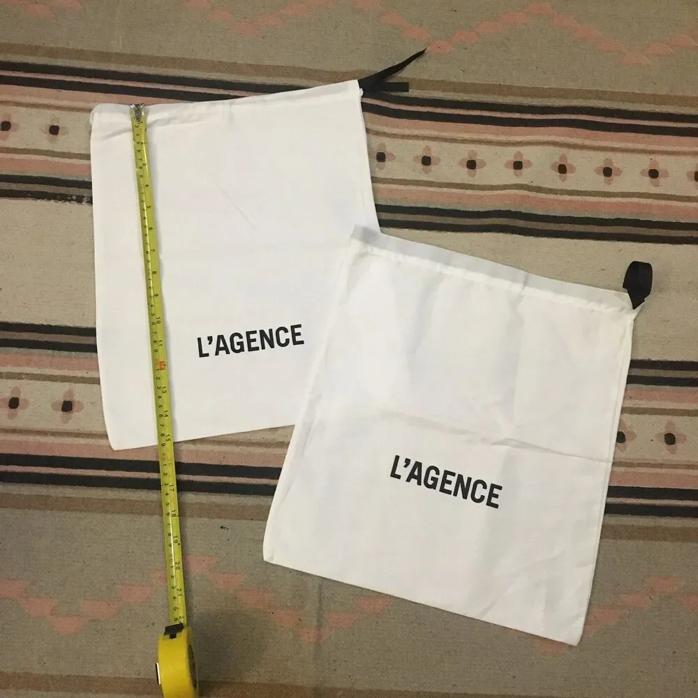 Two (2) L’Agence white w/ black lettering & drawstring Dustbag 15” x 12” new